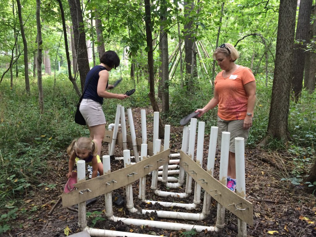 Anna and Roberta Jaggers, and Jen Thomas playing the pipe organ with flip flops